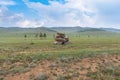 Beautiful stone outlier or rock formation against the background of mountains in the Cis-Baikal basin. Summer mountain landscape Royalty Free Stock Photo