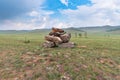 Beautiful stone outlier or rock formation against the background of mountains in the Cis-Baikal basin. Summer mountain landscape Royalty Free Stock Photo