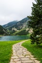 Beautiful stone path leading to the lake in Vall de Nuria valley Sanctuary in the Catalan Pyrenees, Spain Royalty Free Stock Photo