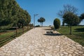 Beautiful stone pavement in mountain village with neat lawn and trees. Sunny day with clear sky in Tavertet, Catalonia