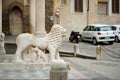 Beautiful stone pillar with a sculpture of a lion on beautiful medieval street of Bergamo city, Italy Royalty Free Stock Photo