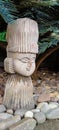 Beautiful stone smiling face sculpture with a closed eyes