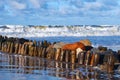 Beautiful storm at sea, breakwaters and rocks in the foreground Royalty Free Stock Photo