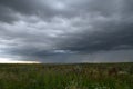 Beautiful storm sky with clouds and field