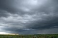Beautiful storm sky with clouds and field Royalty Free Stock Photo