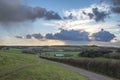 Beautiful stormy moody cloudy sky over English countryside lands Royalty Free Stock Photo