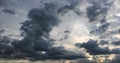 Beautiful stormy sky with clouds background. Dark sky with clouds weather nature cloud storm. Dark storm sky with clouds and sun.