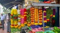 Beautiful strands of colorful flowers hanging up for sale in Singapore.