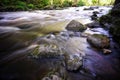 Beautiful  streaming river and rocks in water scene Royalty Free Stock Photo