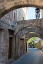 Beautiful street with arches at Rhodes old town, Greece Royalty Free Stock Photo