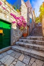 Beautiful street with flowers in the Hvar town, Hvar island, Dalmatia, Croatia. Old Mediterranean street, Hvar town. Old Adriatic Royalty Free Stock Photo