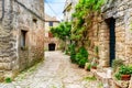 Beautiful street scene with ancient houses in Groznjan town on a sunny day, Croatia