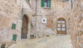 Beautiful street in Valldemossa with traditional flower decoration, famous old mediterranean village of Majorca. Balearic island Royalty Free Stock Photo