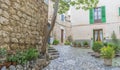 Beautiful street in Valldemossa with traditional flower decoration, famous old mediterranean village of Majorca. Balearic island Royalty Free Stock Photo