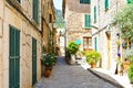 Beautiful street in Valldemossa with traditional flower decoration, famous old mediterranean village of Majorca