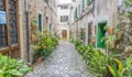 Beautiful street in Valldemossa with traditional flower decoration, famous old mediterranean village of Majorca. Balearic island Royalty Free Stock Photo