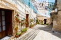 Beautiful street in Valldemossa with traditional flower decoration, famous old mediterranean village of Majorca