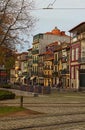 Beautiful street view on the stunning vintage buildings with red tiles on the roofs in Porto city Royalty Free Stock Photo