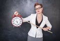 Beautiful strict teacher with clock Royalty Free Stock Photo