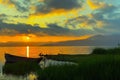 Striking sunset above the lake with bright clouds and sky Royalty Free Stock Photo