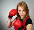 Beautiful strong girl in red gloves for boxing Royalty Free Stock Photo