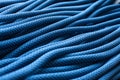 Beautiful and strong. Isolated photo of climbing knots. Top view of blue colored cables