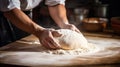 Beautiful and strong mens hands knead the dough make bread, pasta or pizza. Powdery flour flying into air. chef hands Royalty Free Stock Photo