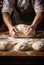 Beautiful and strong mens hands knead the dough make bread, pasta or pizza. Powdery flour flying into air. chef hands Royalty Free Stock Photo