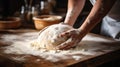 Beautiful and strong mens hands knead the dough make bread, pasta or pizza. Powdery flour flying into air. chef hands Royalty Free Stock Photo