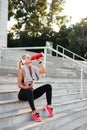 Beautiful strong young sports woman drinking water Royalty Free Stock Photo