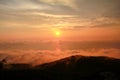 Beautiful structure of clouds on sky, mountain landscape with dense fog at sunset on horizon of beauty natural environment. Royalty Free Stock Photo