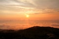 Beautiful structure of clouds on sky, mountain landscape with dense fog at sunset on horizon of beauty natural environment. Royalty Free Stock Photo