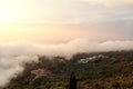 Beautiful structure of clouds on sky, mountain landscape with dense fog at sunset on horizon of beauty natural environment. Royalty Free Stock Photo