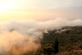 Beautiful structure of clouds on sky, mountain landscape with dense fog at sunset on horizon of beauty natural environment. Royalty Free Stock Photo