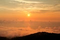 Beautiful structure of clouds on sky, mountain landscape with dense fog at sunset on horizon of beauty natural environment. Royalty Free Stock Photo