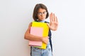 Beautiful student child girl wearing backpack glasses books over isolated white background with open hand doing stop sign with Royalty Free Stock Photo