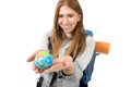 Beautiful student girl holding little world globe in her hand choosing holidays destination in travel tourism concept Royalty Free Stock Photo
