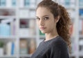 Beautiful student girl posing at the library Royalty Free Stock Photo