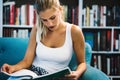 Beautiful student girl studying, reading book at home Royalty Free Stock Photo