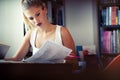 Beautiful student girl studying, reading book at home Royalty Free Stock Photo