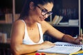 Beautiful student girl studying, reading book at home Royalty Free Stock Photo