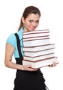 Beautiful student is holding a lot of books Royalty Free Stock Photo