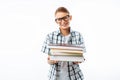 Beautiful student holding a stack of books, a botanist goes with books to study in the Studio on a white background