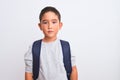 Beautiful student kid boy wearing backpack standing over isolated white background with serious expression on face Royalty Free Stock Photo