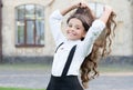 Beautiful student teen girl has long hair. cute smiling confident schoolgirl jumping. sense of freedom. back to school Royalty Free Stock Photo