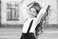 Beautiful student teen girl has long hair. cute smiling confident schoolgirl jumping. sense of freedom. back to school Royalty Free Stock Photo