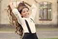 beautiful student teen girl has long hair. cute smiling confident schoolgirl jumping. sense of freedom. back to school Royalty Free Stock Photo