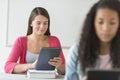 Beautiful Student Using Digital Tablet At Desk Royalty Free Stock Photo