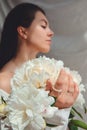 beautiful stunning woman with peonies flowers Royalty Free Stock Photo