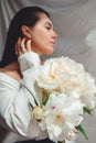 beautiful stunning woman with peonies flowers Royalty Free Stock Photo